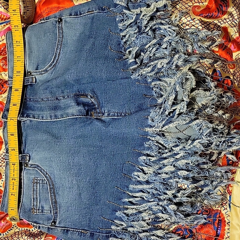 Shredded Jean shorts with metal fringe